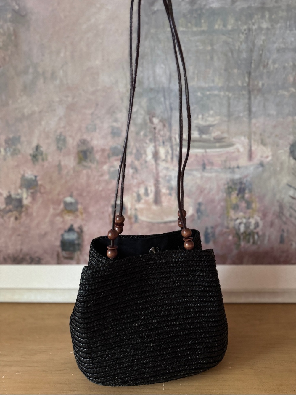 Elegant Black Wheat Straw Bucket Bag with Brown Decorative Straps - Picture 2 of 7